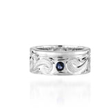 The picture shows a 925 sterling silver ring with scroll hand-engravings and sapphire.