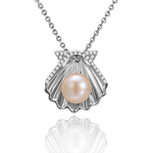 In this photo there is a white gold oyster shell pendant with a light pink pearl and diamonds.