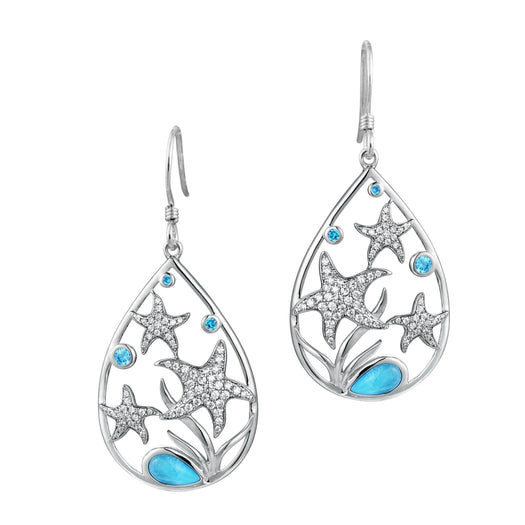 The picture shows a pair of sea star larimar earrings with topaz and aquamarine gemstones. 