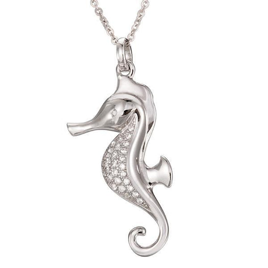 In this photo there is a white gold seahorse pendant with topaz gemstones.