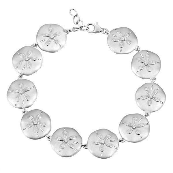 The picture shows a white gold sand dollar bracelet with topaz.