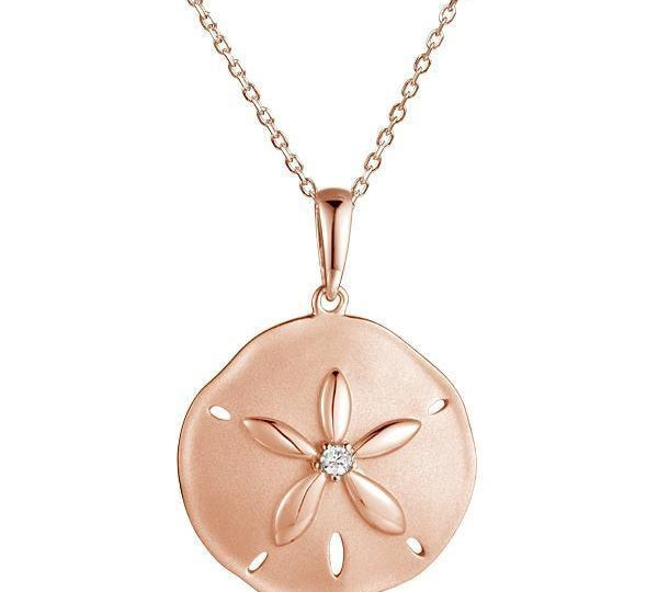 The picture shows a 14K rose gold sand dollar pendant with a central diamond.