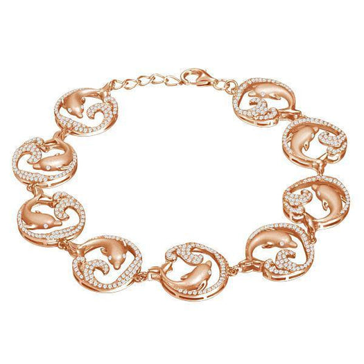 The picture shows a rose gold dolphin bracelet with topaz.