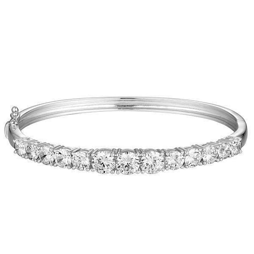The photo shows a white gold tennis bracelet bangle with topaz.
