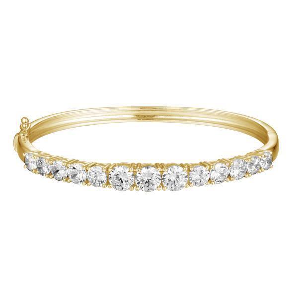 The photo shows a yellow gold tennis bracelet bangle with topaz.