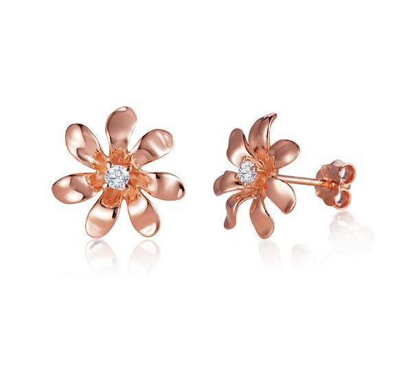 In this photo there is a pair of rose gold tiare flower stud earrings with diamonds.