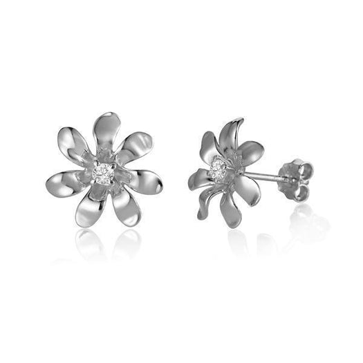 In this photo there is a pair of white gold tiare flower stud earrings with diamonds.