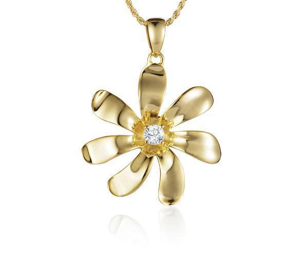 In this photo there is a yellow gold tiare flower pendant with one diamond.