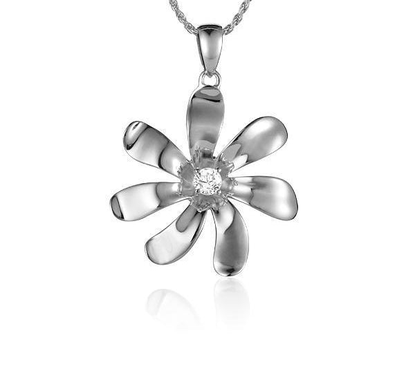 In this photo there is a white gold tiare flower pendant with one diamond.