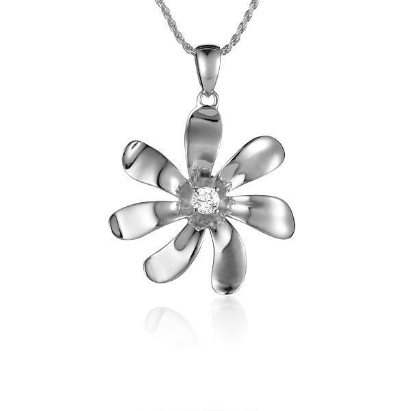 In this photo there is a white gold tiare flower pendant with one diamond.