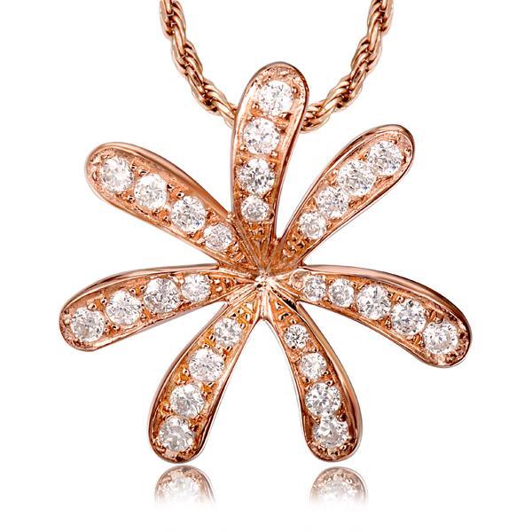 In this photo there is a rose gold tiare gardenia pendant with topaz gemstones.