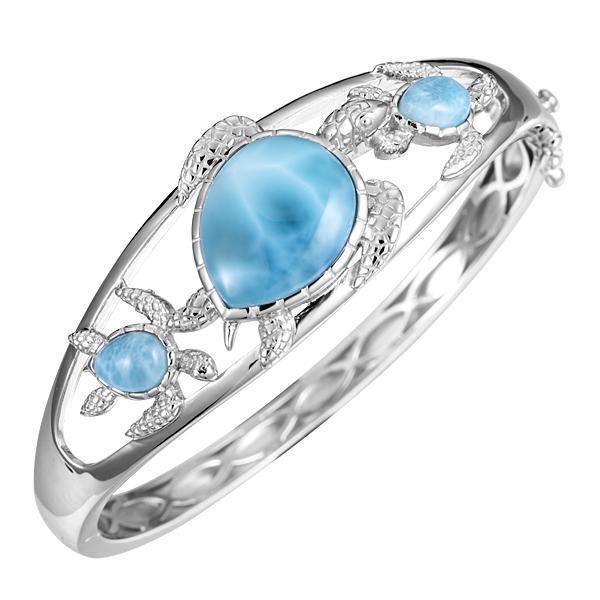The picture shows a 925 sterling silver three sea turtle bracelet with three larimar gemstones.