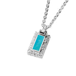 The photo shows a 925 sterling silver bar pendant with hand-engraved detailing and one large turquoise gemstone.