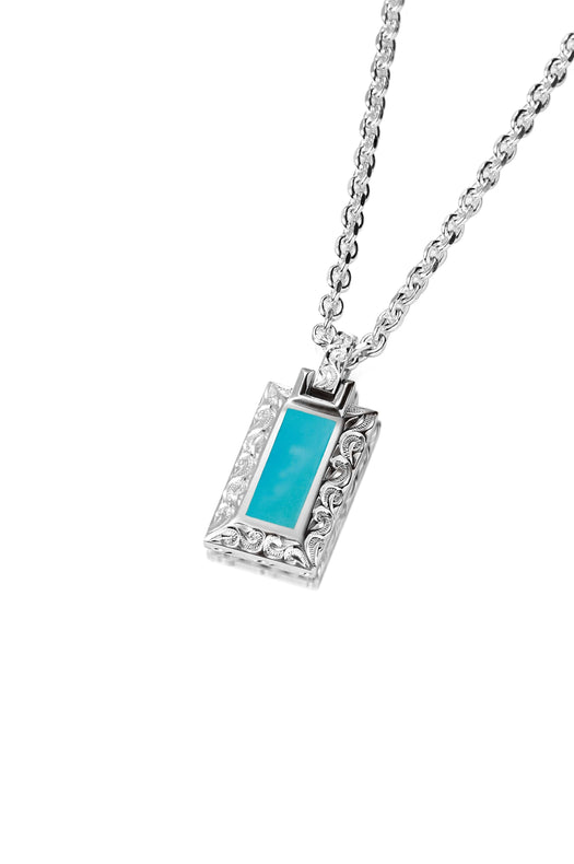 The photo shows a 925 sterling silver bar pendant with hand-engraved detailing and one large turquoise gemstone.