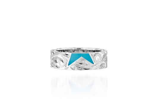 The picture shows a 925 sterling silver star matching ring with hand engravings and a turquoise gemstone.