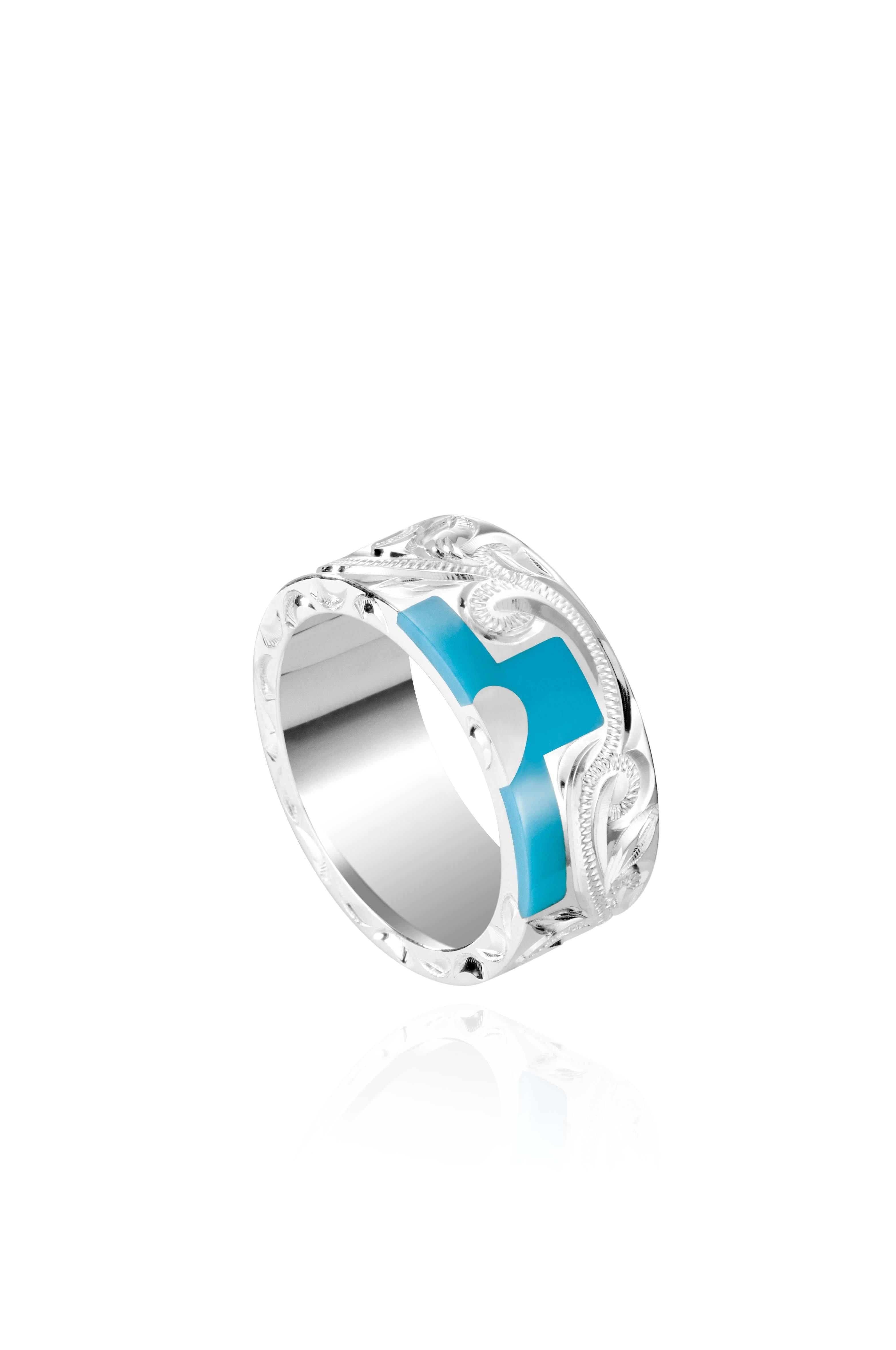 The picture shows a part of a set 925 sterling silver right half cross ring with hand-engravings, heart, and a turquoise gemstone.