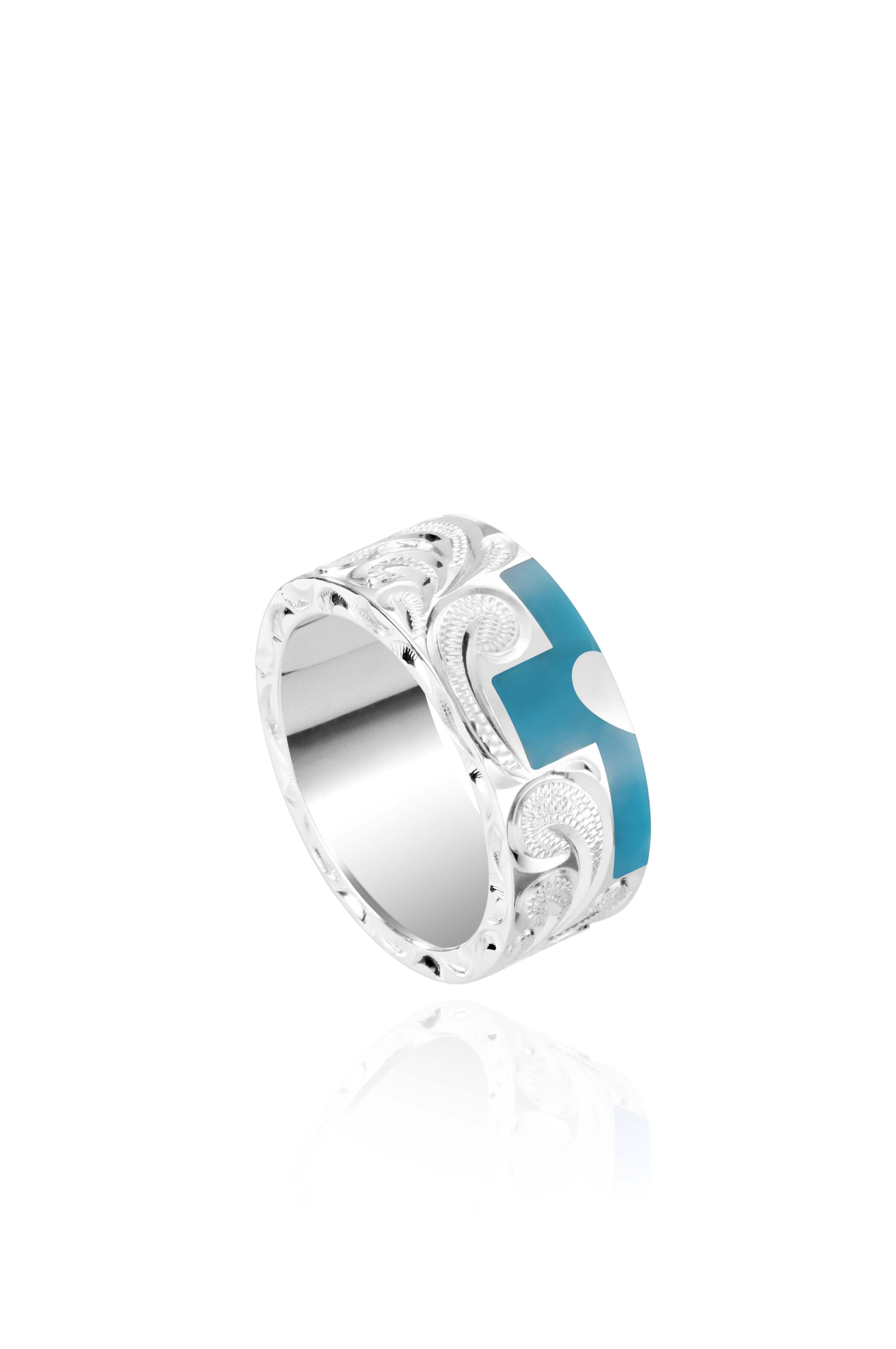 The picture shows a part of a set 925 sterling silver left half cross ring with hand-engravings, heart, and a turquoise gemstone.