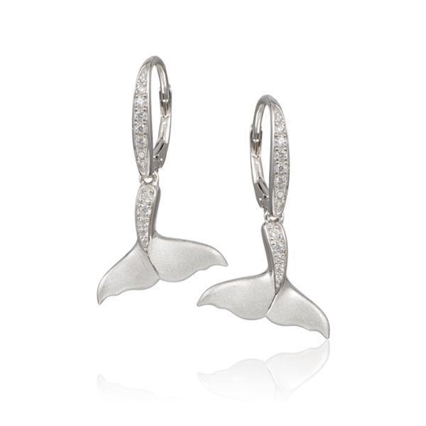 The picture shows a pair of 925 sterling silver whale tail earrings with topaz.
