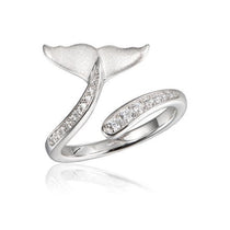 The picture shows a 925 sterling silver whale tail ring with topaz.